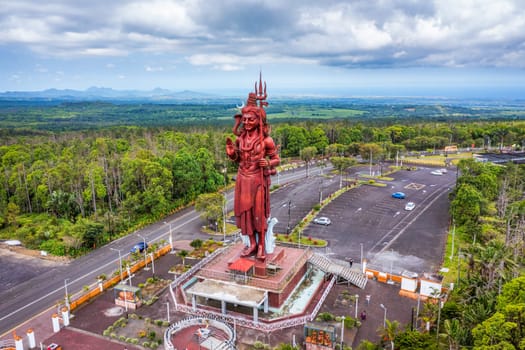 Shiva statue at Grand Bassin temple, the world's tallest Shiva temple, it is 33 meters tall. Important hindu temples of Mauritius. A large statue of the Hindu god Shiva, seen from above, Mauritius.