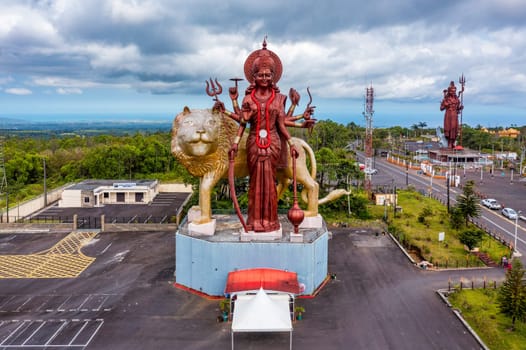 A powerful Statue of the Hindu goddess Durga Maa with a golden lion in sacred Ganga Talao. Shiva statue at Grand Bassin temple, the world's tallest Shiva temple, it is 33 meters tall. Mauritius