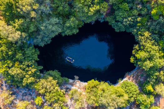 Famous Melissani lake on Kefalonia island, Karavomylos, Greece. On top of Melissani Cave (Melissani Lake) in Karavomylos village in Kefalonia island , Greece. Melissani Cave viewed from above.