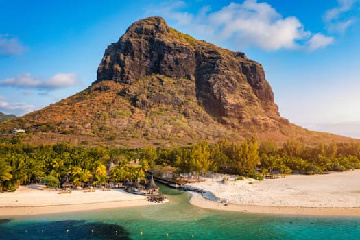 Aerial view of Le morne Brabant in Mauriutius. Tropical crystal ocean with Le Morne mountain and luxury beach in Mauritius. Le Morne beach with palm trees, white sand and luxury resorts, Mauritius.