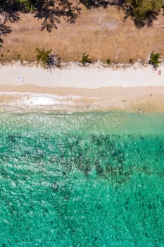 Beautiful Mauritius island with beach Flic en flac. Coral reef around tropical palm beach, Flic en Flac, Mauritius. Aerial view of a beautiful beach along the coast in Flic en Flac, Mauritius.