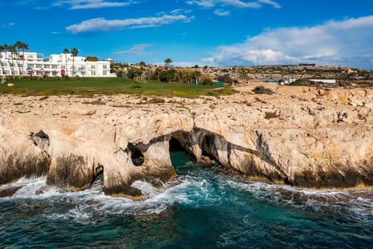 Beautiful bridge of lovers natural rock arch near of Ayia Napa, Cavo Greco and Protaras on Cyprus island, Mediterranean Sea. Legendary bridge lovers. Amazing blue green sea and sunny day