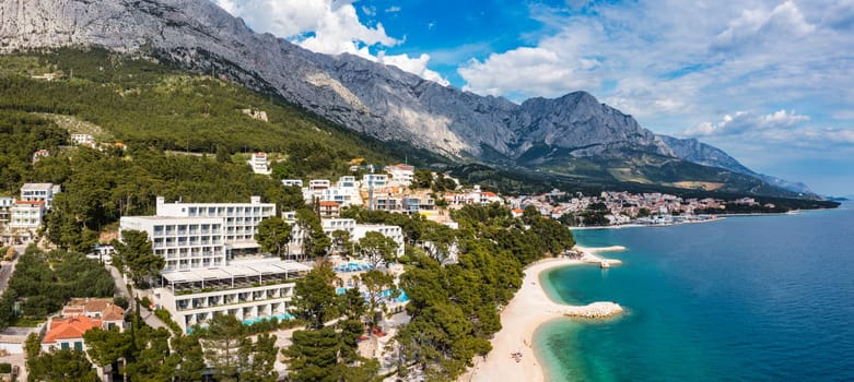 Beautiful Brela on Makarska riviera, Croatia. Adriatic Sea with amazing turquoise clean water and white sand. Aerial view of Brela town and waterfront on Makarska riviera, Dalmatia region of Croatia.