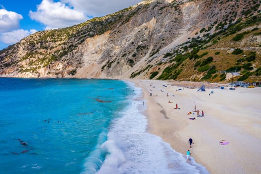 Aerial drone view of iconic turquoise and sapphire bay and beach of Myrtos, Kefalonia (Cephalonia) island, Ionian, Greece. Myrtos beach, Kefalonia island, Greece. Beautiful view of Myrtos beach.