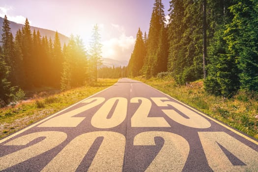 Empty asphalt road and New year 2025 concept. Driving on an empty road in the mountains to upcoming 2025 and leaving behind old 2024. Concept for success and passing time.