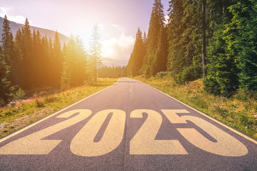 Empty asphalt road and New year 2025 concept. Driving on an empty road in the mountains to upcoming 2025. Concept for success and passing time.