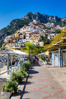 View of Positano with comfortable beach and blue sea on Amalfi Coast in Campania, Italy. Positano village on the Amalfi Coast, Salerno, Campania. Beautiful Positano, Amalfi Coast in Campania.