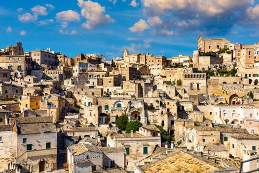 Panoramic view of the ancient town of Matera (Sassi di Matera) in a beautiful autumn day, Basilicata, southern Italy. Stunning view of the village of Matera. Matera is a city on a rocky outcrop.