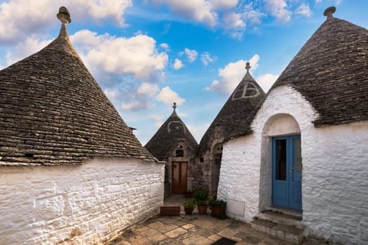 The traditional Trulli houses in Alberobello city, Apulia, Italy. Cityscape over the traditional roofs of the Trulli, original and old houses of this region, Apulia, Alberobello, Puglia, Italy. 