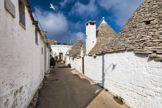 The traditional Trulli houses in Alberobello city, Apulia, Italy. Cityscape over the traditional roofs of the Trulli, original and old houses of this region, Apulia, Alberobello, Puglia, Italy. 