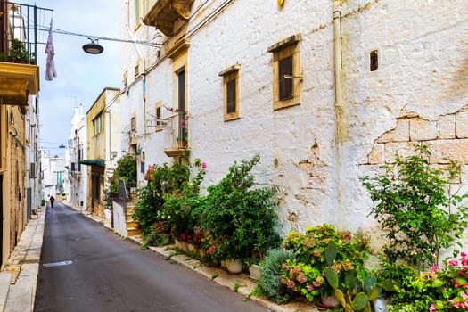 Scenic sight in Locorotondo, Bari Province, Apulia (Puglia), Italy. Characteristic streets in the Locorotondo in Puglia, Italy. Locorotondo is a town of the Metropolitan City of Bari, Apulia, Italy.