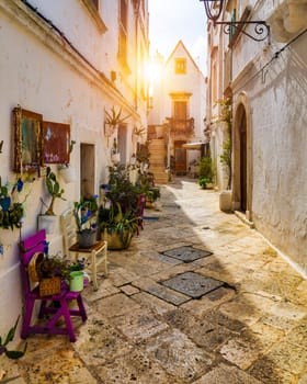 Scenic sight in Locorotondo, Bari Province, Apulia (Puglia), Italy. Characteristic streets in the Locorotondo in Puglia, Italy. Locorotondo is a town of the Metropolitan City of Bari, Apulia, Italy.