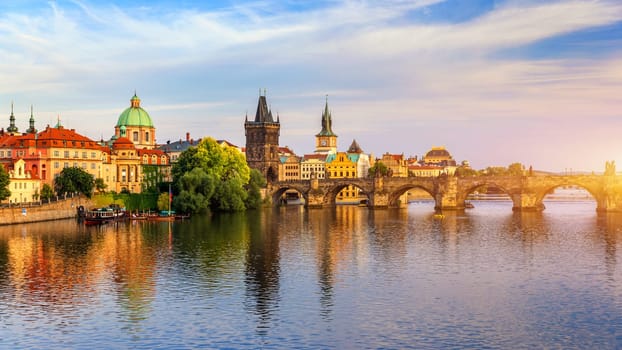Charles Bridge in Prague in Czechia. Prague, Czech Republic. Charles Bridge (Karluv Most) and Old Town Tower. Vltava River and Charles Bridge. Concept of world travel, sightseeing and tourism.