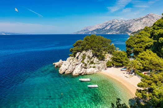Amazing aerial view of the beautiful Podrace beach in Brela, Makarska Riviera, Croatia. Aerial view of Podrace beach and waterfront on Makarska riviera, Brela, Dalmatia region of Croatia.