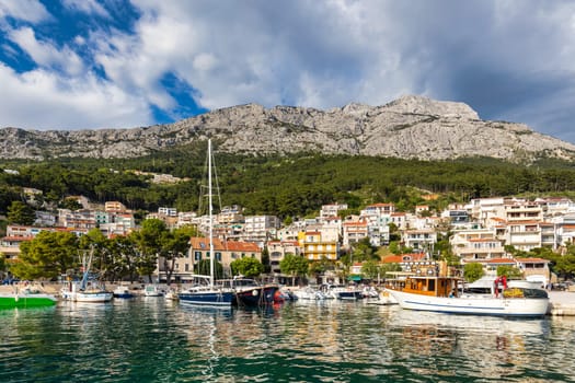 Beautiful Brela on Makarska riviera, Croatia. Adriatic Sea with amazing turquoise clean water and white sand. Aerial view of Brela town and waterfront on Makarska riviera, Dalmatia region of Croatia.