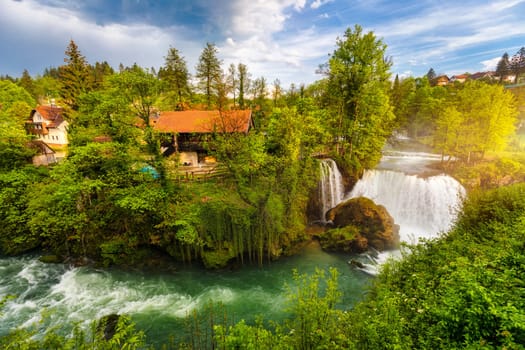 Village of Rastoke near Slunj in Croatia, old water mills on waterfalls of Korana river, beautiful countryside landscape. Landscape with river and little waterfalls in Rastoke village, Croatia.