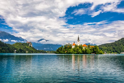 Lake Bled in Slovenia. Beautiful mountains and Bled lake with small Pilgrimage Church. Bled lake and island with Pilgrimage Church of the Assumption of Maria. Bled, Slovenia, Europe.