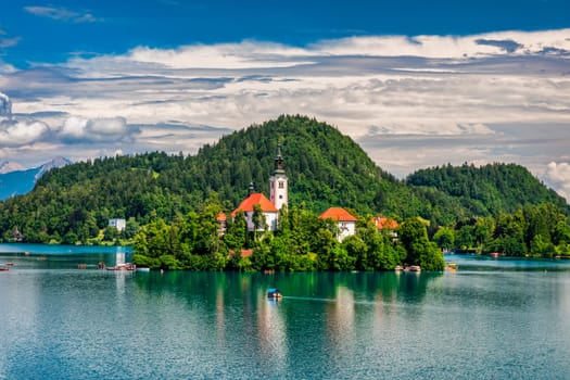 Lake Bled in Slovenia. Beautiful mountains and Bled lake with small Pilgrimage Church. Bled lake and island with Pilgrimage Church of the Assumption of Maria. Bled, Slovenia, Europe.