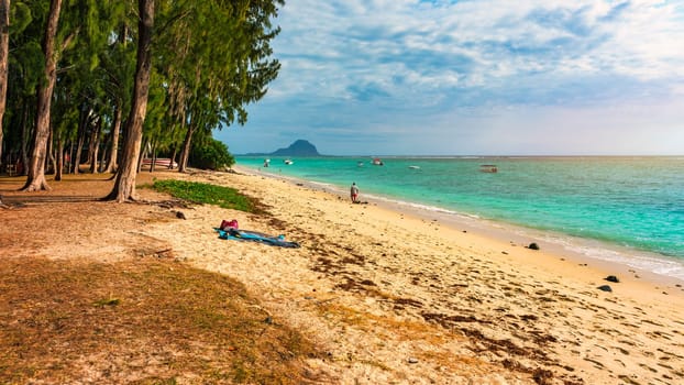 Beach of Flic en Flac with beautiful peaks in the background, Mauritius. Beautiful Mauritius Island with gorgeous beach Flic en Flac. Flic en Flac Beach, Mauritius Island.