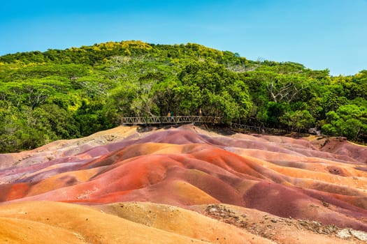 Chamarel Seven Colored Earth Geopark in Mauritius Island. Colorful panoramic landscape about this volcanic geological formation Chamarel Seven Colored Earth Geopark in Riviere noire district.