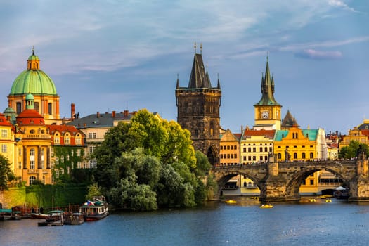 Charles Bridge in Prague in Czechia. Prague, Czech Republic. Charles Bridge (Karluv Most) and Old Town Tower. Vltava River and Charles Bridge. Concept of world travel, sightseeing and tourism.