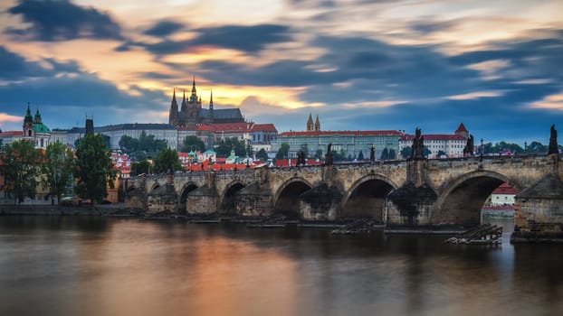 View of Prague Castle and Charles Bridge at sunset. Czechia