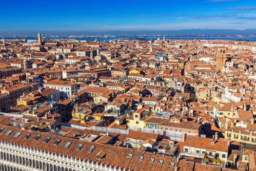 Venice panoramic aerial view with red roofs, Veneto, Italy. Aerial view of the Venice city, Italy. Venice is a popular tourist destination of Europe. Venice, Italy.