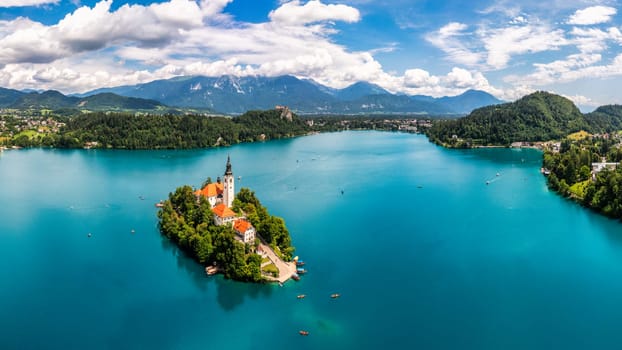 Lake Bled in Slovenia. Beautiful mountains and Bled lake with small Pilgrimage Church. Bled lake and island with Pilgrimage Church of the Assumption of Maria. Bled, Slovenia, Europe.