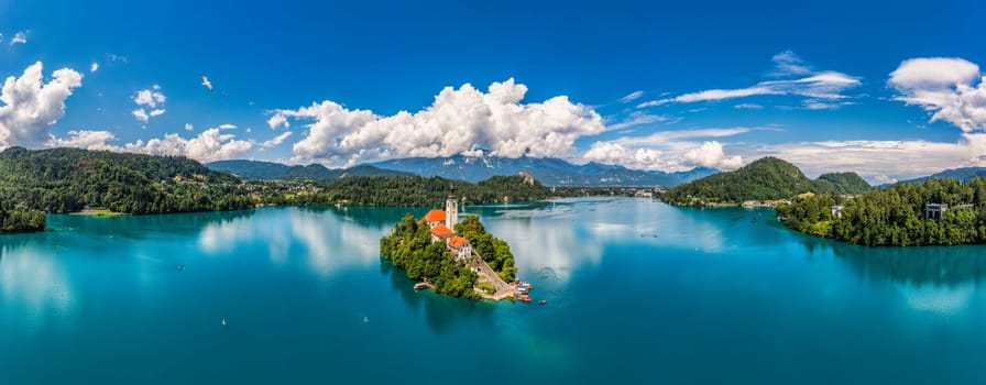 Lake Bled in Slovenia. Beautiful mountains and Bled lake with small Pilgrimage Church. Bled lake and island with Pilgrimage Church of the Assumption of Maria. Bled, Slovenia, Europe.