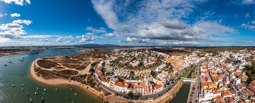 View of Ferragudo village in Algarve, Portugal. Old sea town of Ferragudo. View of Ferragudo from the air. Ferragudo is a beautiful coastal village in Algarve, Portugal, Europe.