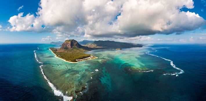 Aerial view of Mauritius island panorama and famous Le Morne Brabant mountain, beautiful blue lagoon and underwater waterfall. Le Morne Brabant peninsula and Underwater Waterfall, Mauritius.