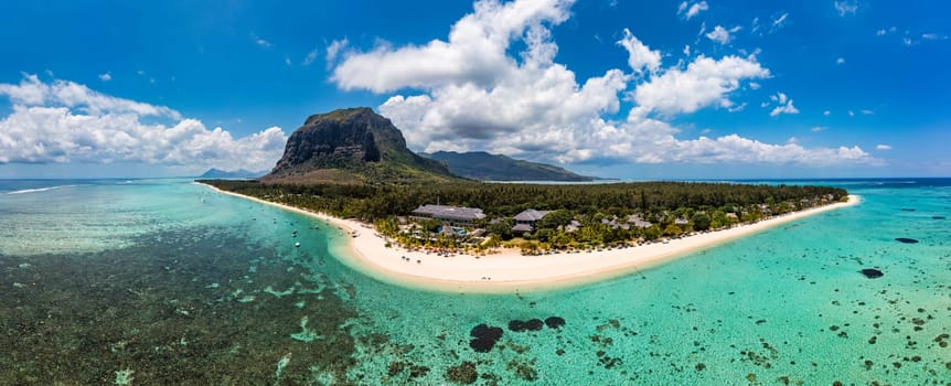 Aerial view of Le morne Brabant in Mauriutius. Tropical crystal ocean with Le Morne mountain and luxury beach in Mauritius. Le Morne beach with palm trees, white sand and luxury resorts, Mauritius.