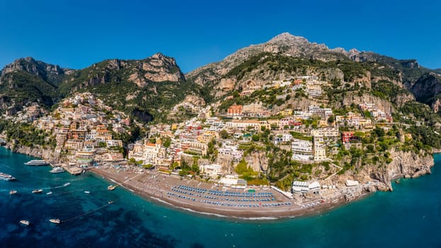 Aerial view of Positano with comfortable beach and blue sea on Amalfi Coast in Campania, Italy. Positano village on the Amalfi Coast, Salerno, Campania. Beautiful Positano, Amalfi Coast in Campania.