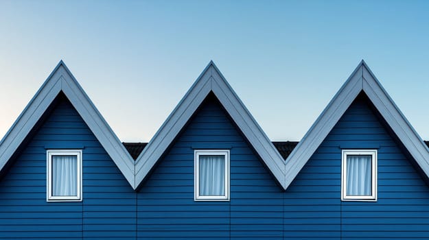 Three houses with blue facades and white triangular roofs are aligned under a clear blue sky. Each house has a single white-framed window - Generative AI