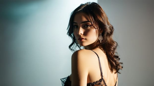 Upbeat and lively Hispanic lingerie model standing in high key lighting studio adorned in chic.