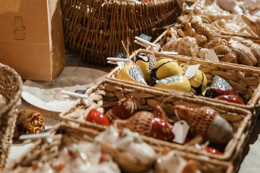 Sale of handmade ceramic Christmas tree toys at the Christmas Fair. Black Friday for the winter holidays