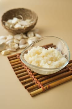 close up of minced garlic on a wooden spoon ,