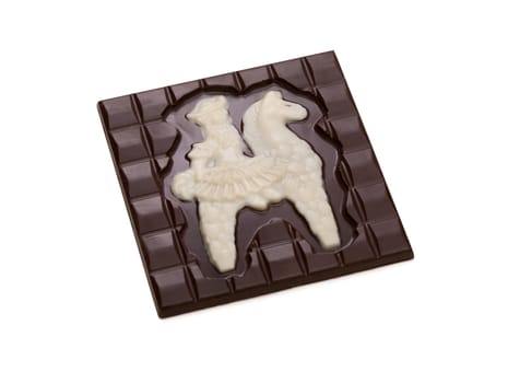 Delicious chocolate bar with figurine of knight on horseback