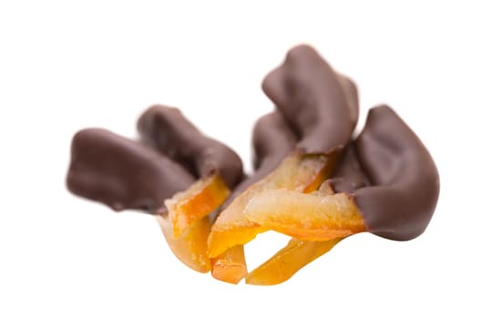 Image of orange slices in dark chocolate, close-up