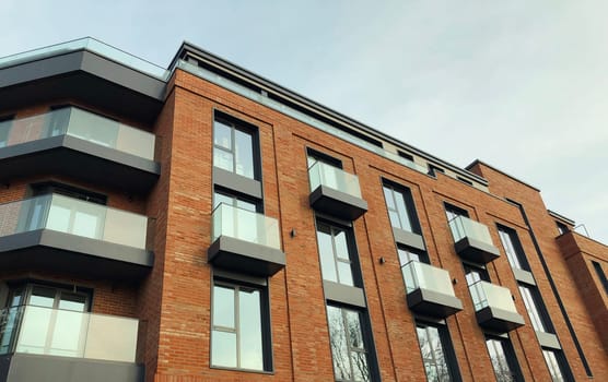 Architecture, real estate, residential apartment building with panoramic windows, modern complex