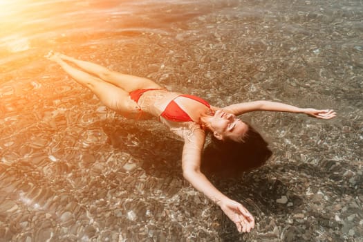 Weight loss and body image concept. Woman with perfect fit body walking confident on beach. Unrecognizable sexy young woman.