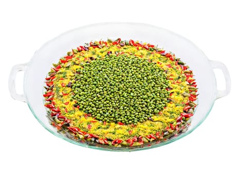 Vegetarian paella with artichokes peppers and peas served on a transparent glass dish colorful. Food isolated on transparent background.