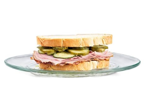 Sandwich cubano with roast pork ham Swiss cheese and pickles served on a transparent glass. Food isolated on transparent background.