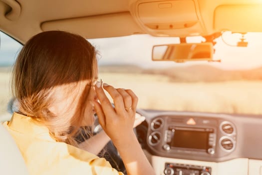 Relaxed business woman talking on video call on phone in automobile. Rested female professional saying bye on video chat in business car. Beautiful lady making video message in luxury car.