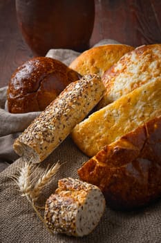 A close up still life photo of various loafs of natural whole bread.