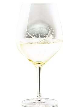 Zwiesel 1872 The First Sauvignon Blanc glass, distinctive angular silhouette, crisp pale yellow wine, splashing motion, dynamic side view, dark contrasting background, isolated.