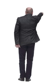 rear view . confident business man looking at the white wall. isolated on a white background