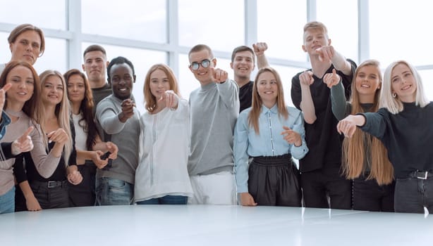 multinational group of young people pointing at you. photo with copy space