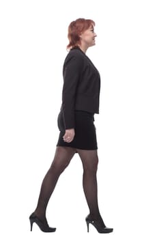 in full growth. modern business woman stepping forward. isolated on a white background.