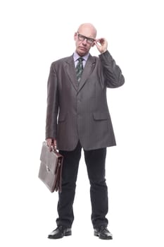 in full growth.smiling business man with a smartphone. isolated on a white background.